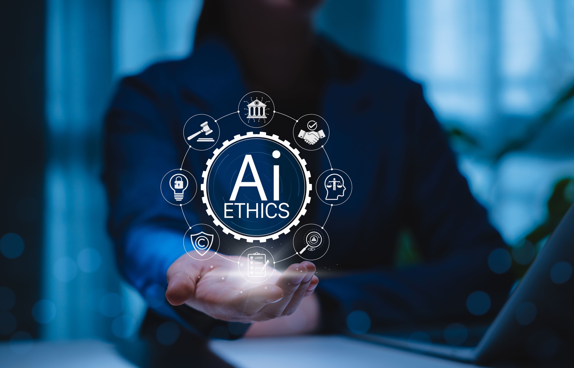 AI Ethics and Responsible Artificial Intelligence Governance Concept. Person holding icons for AI ethics, regulations, law, fairness, transparency, data protection, privacy, and ethical practices.